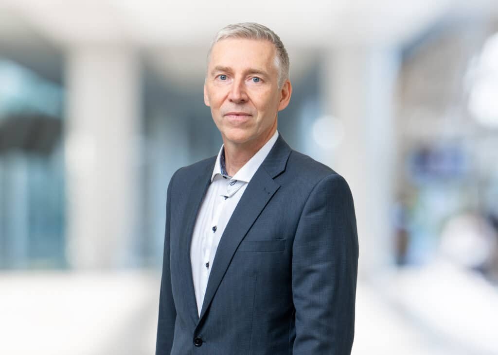 Mats Forsman, professional headshot of a smiling man wearing a suit